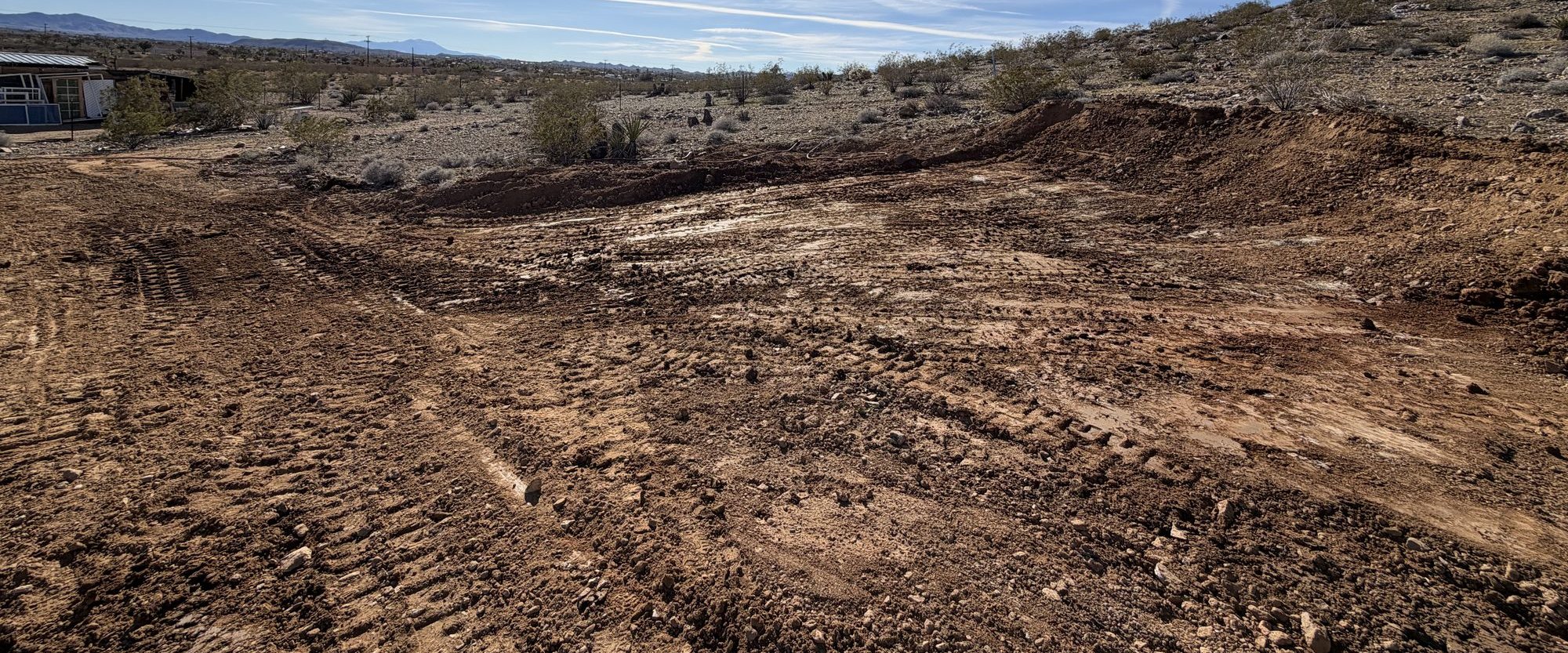 Cleared desert parcel with a ridge line beyond